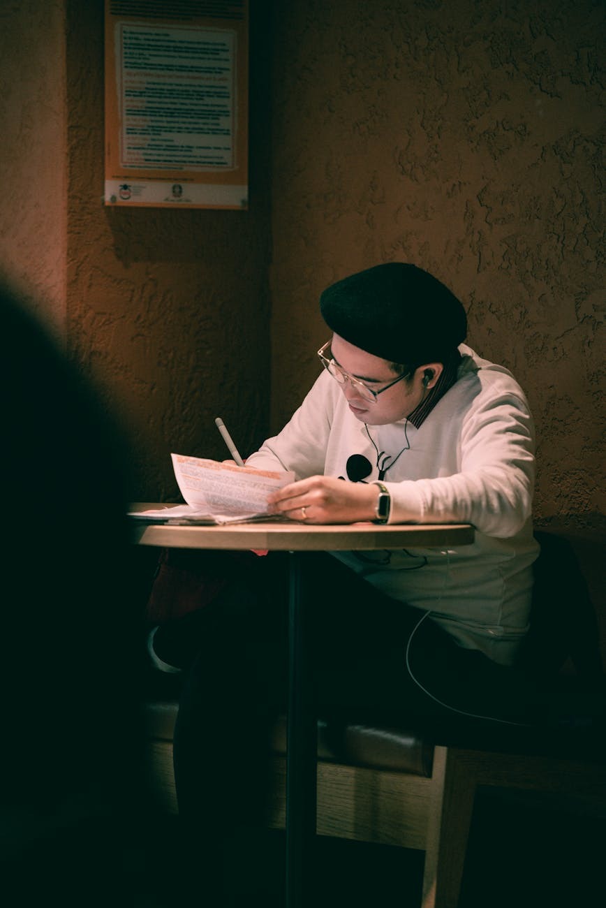 Researcher at desk with notebook studying game narrative
